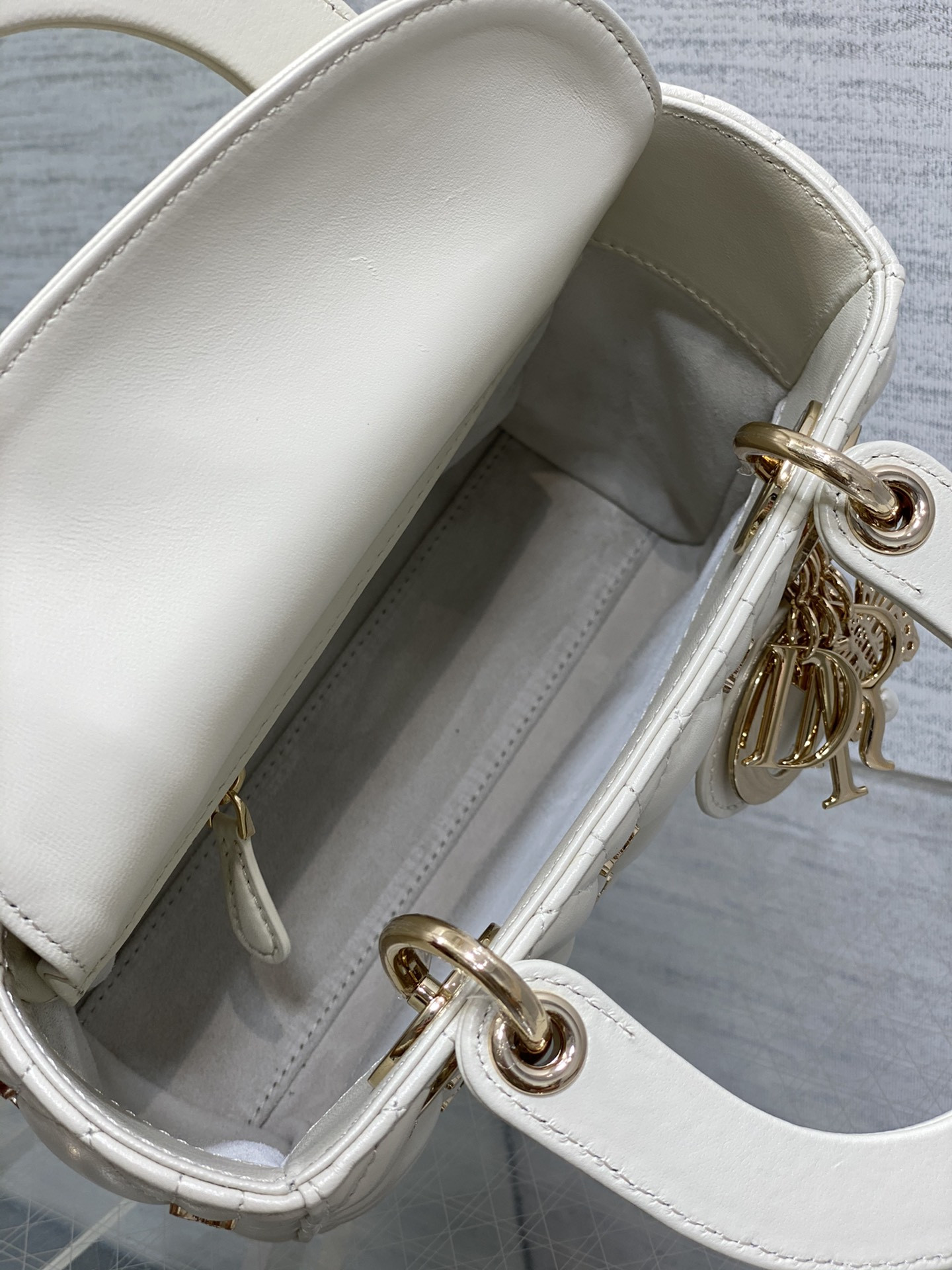 small lady D*or white with butterfly studs